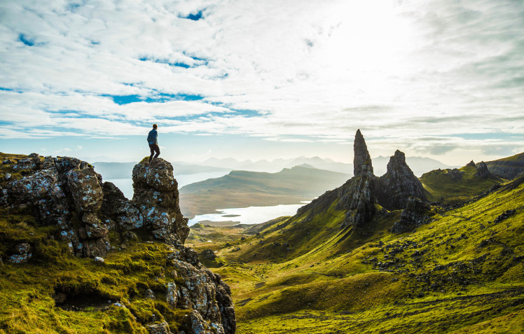 Hiker looking at view of Scottish highland cliffs Skye iStock_000061488168_Large-2