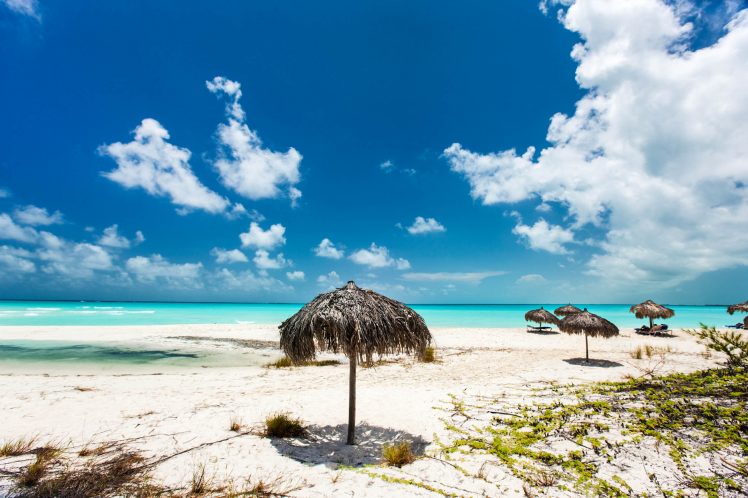 Tropical thatch umbrellas on a beautiful Caribbean beach