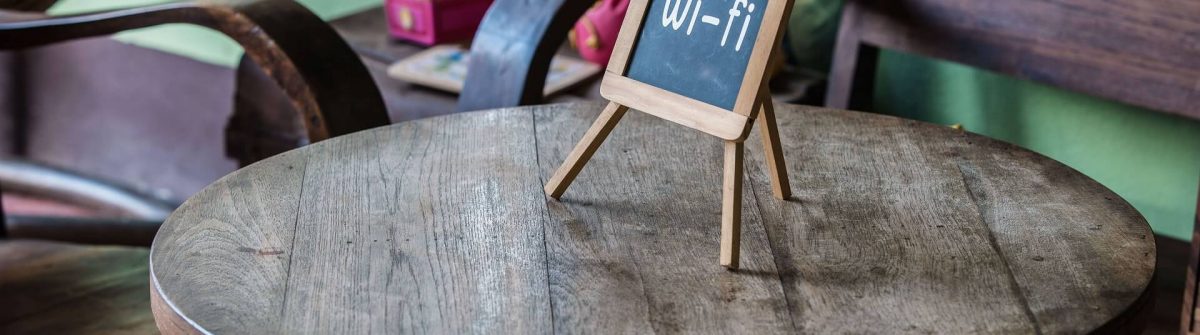 Wifi-sign-on-wood-table-in-public-cafe-shutterstock_330475616_1920x1281