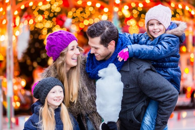 Family-eating-cotton-candy-on-Christmas-market_shutterstock_339369647_900x600