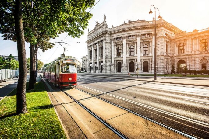 Wiener-Ringstrasse-with-tram-and-Burgtheater-at-sunrise-Vienna-iStock_000060702174_900x600